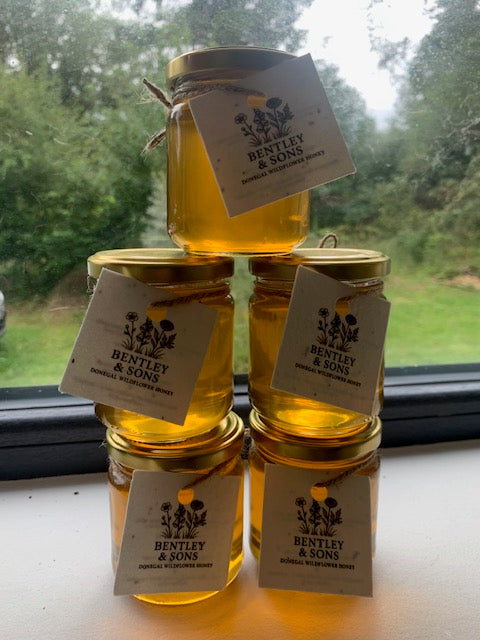 Four jars of raw honey with Bentley & Sons