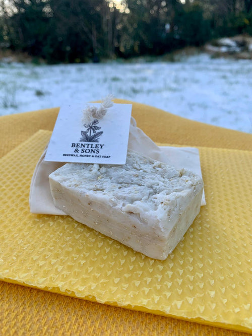Close-up of beeswax honey oat soap with visible texture