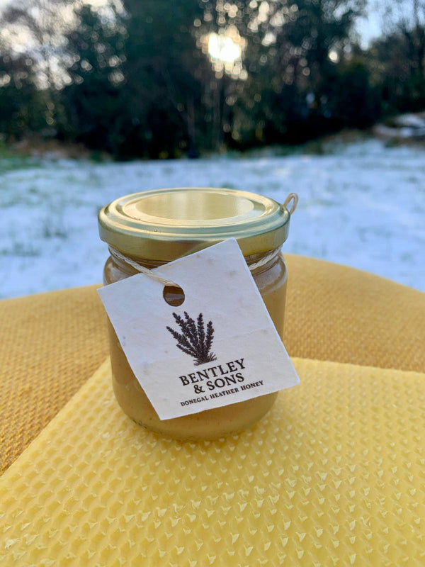Jar of Donegal heather honey with rich amber colour